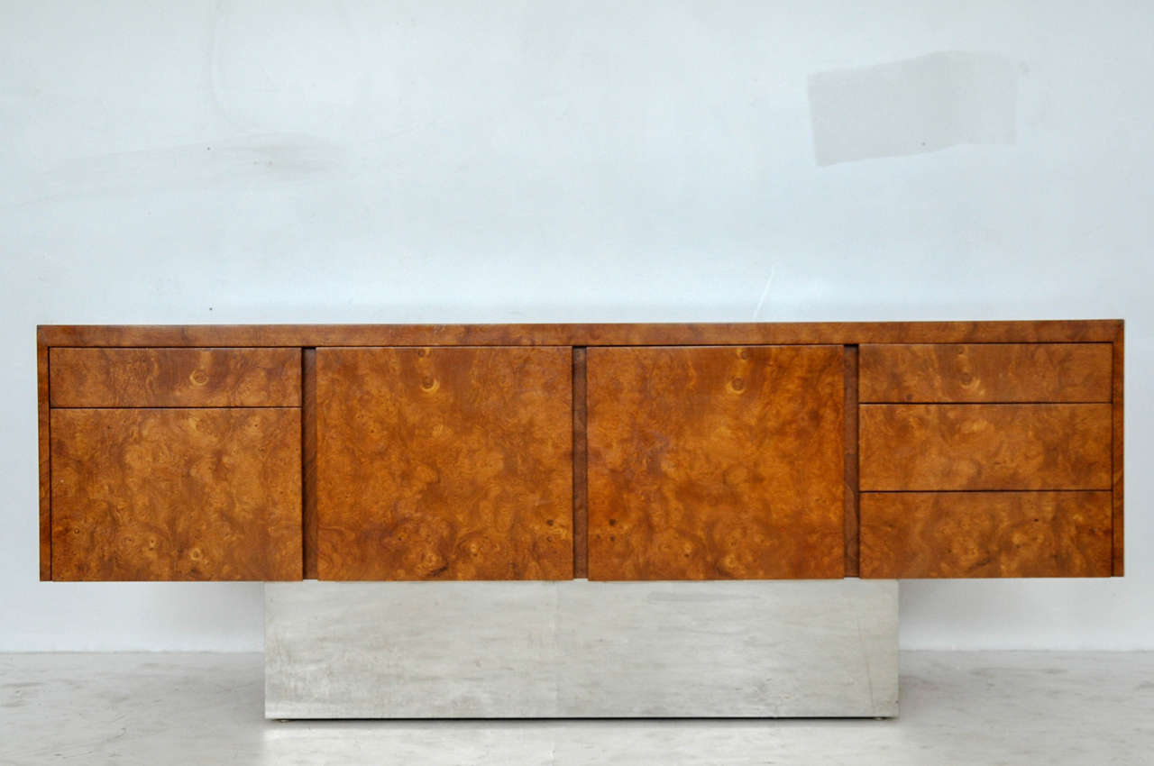 Eppinger Furniture NY desk, circa 1970s. Highest quality construction. Burl wood case appears to float on polish chrome pedestal.

Matching desk available.