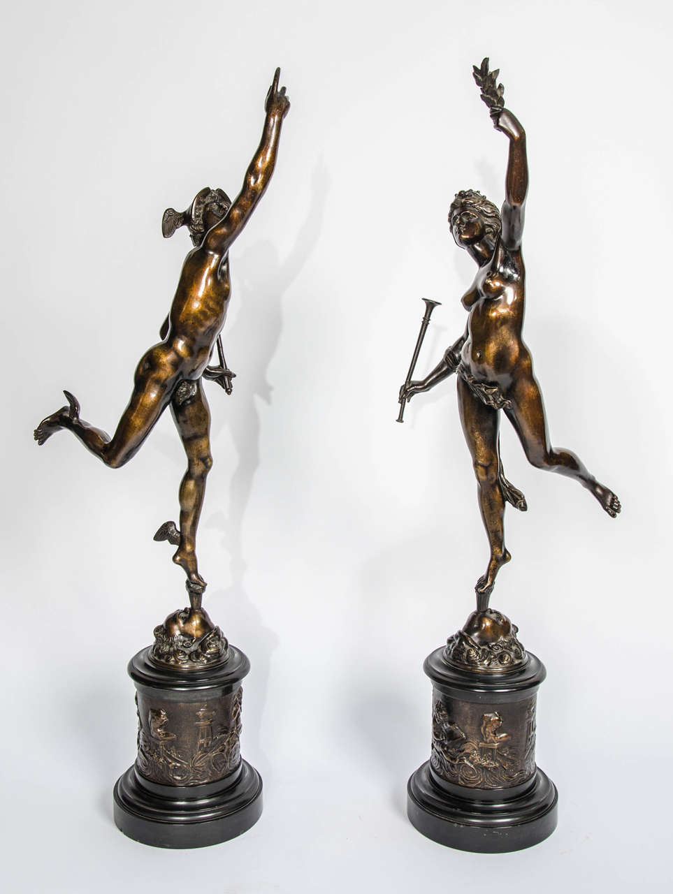 A good quality pair of bronze statues depicting Mercury and Fortuna, both supported by gusts of wind issuing from the mouths of Boreas, all supported on bases decorated with cherubs in relief.
After; Giambologna (1529-1608).