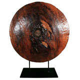 Old Wood Wheel Mounted on Iron Stand