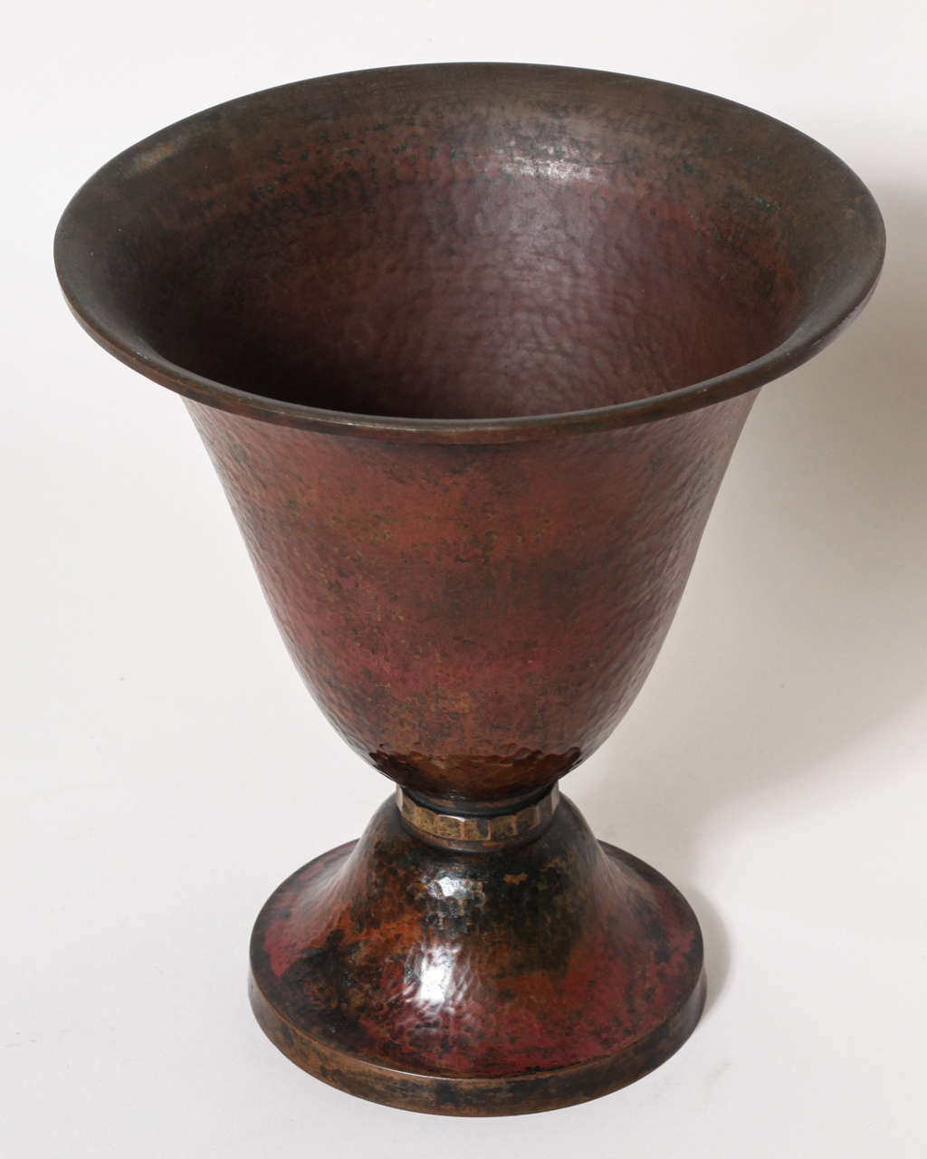 Copper dinanderie vase in tulip form with fluted brass ring separating the vase from the base. This is a very rarified vase with incredible rich red patina and a wonderful form.
Signed: Th Chanut/ Lyon/ Depose/ small flower on brass plate