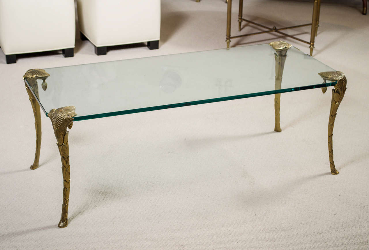 A stunning cocktail table by Maison CHARLES with gilt/bronze, foliated legs and beveled glass top.
Stamped - Charles, Paris
Second half 20th century