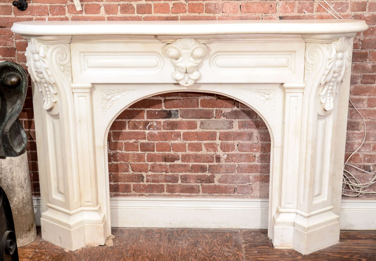 This white Victorian mantel is beautiful! From East 10th St, NYC. It has great corbels on both sides with an arched opening. The keystone is original. The lines and width of this mantel make it great size for a library, parlor or living room. This