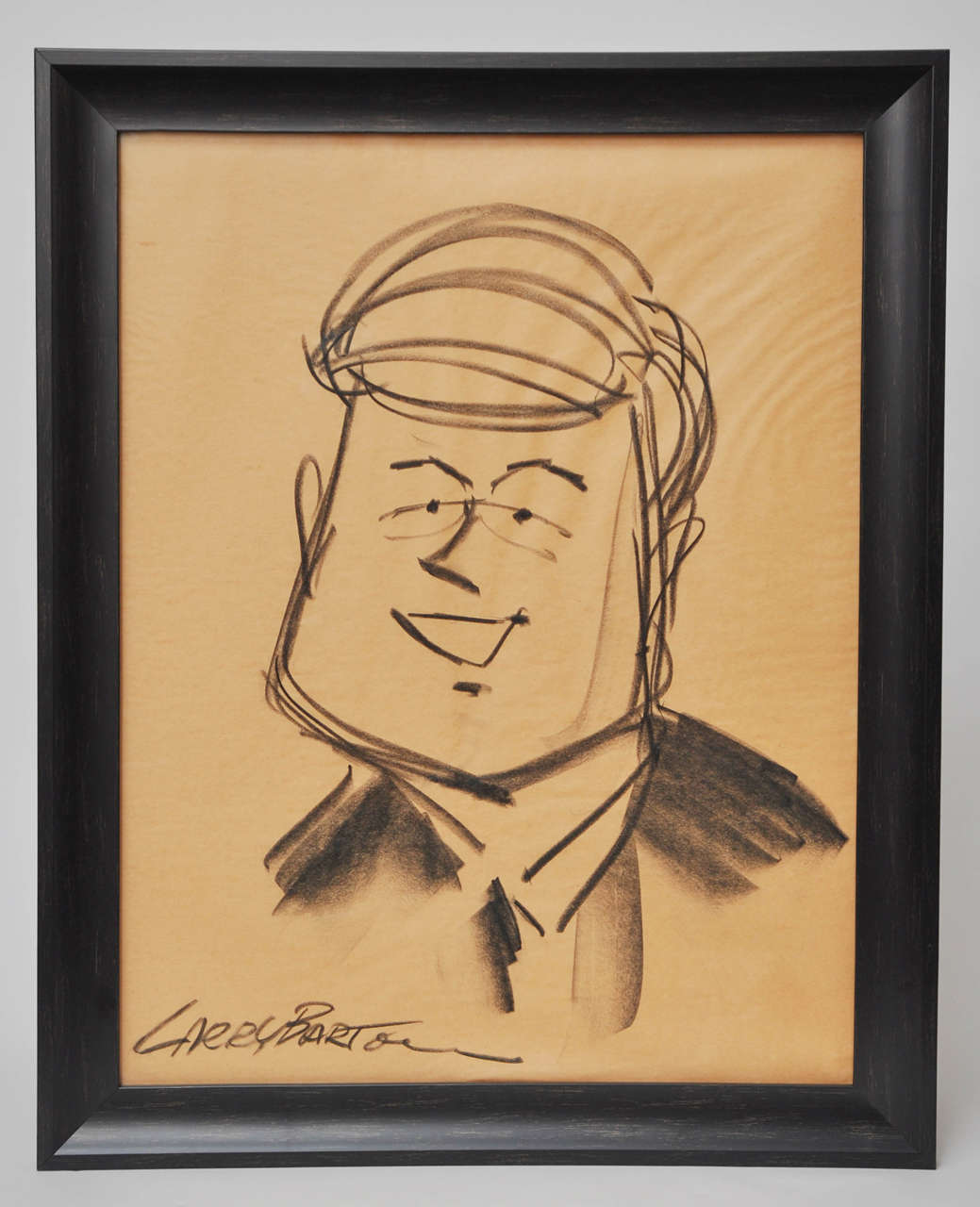 A wonderfully whimsical drawing of JFK on paper. Newly framed. Signed by Larry Barton.