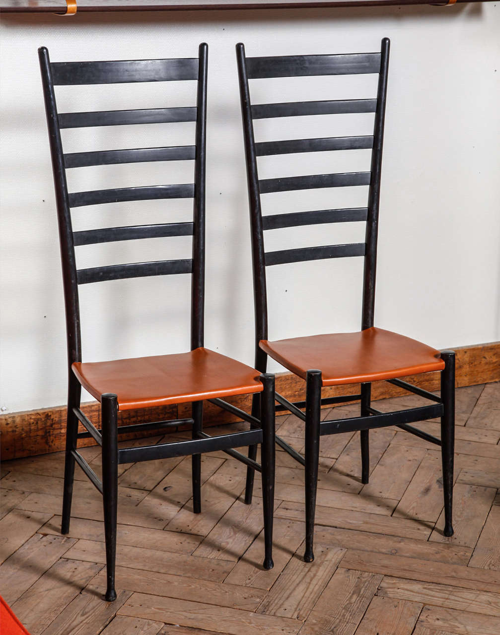 In the style of Gio Ponti

Pair of high back chairs

We offer affordable worldwide shipping. Feel free to inquire!