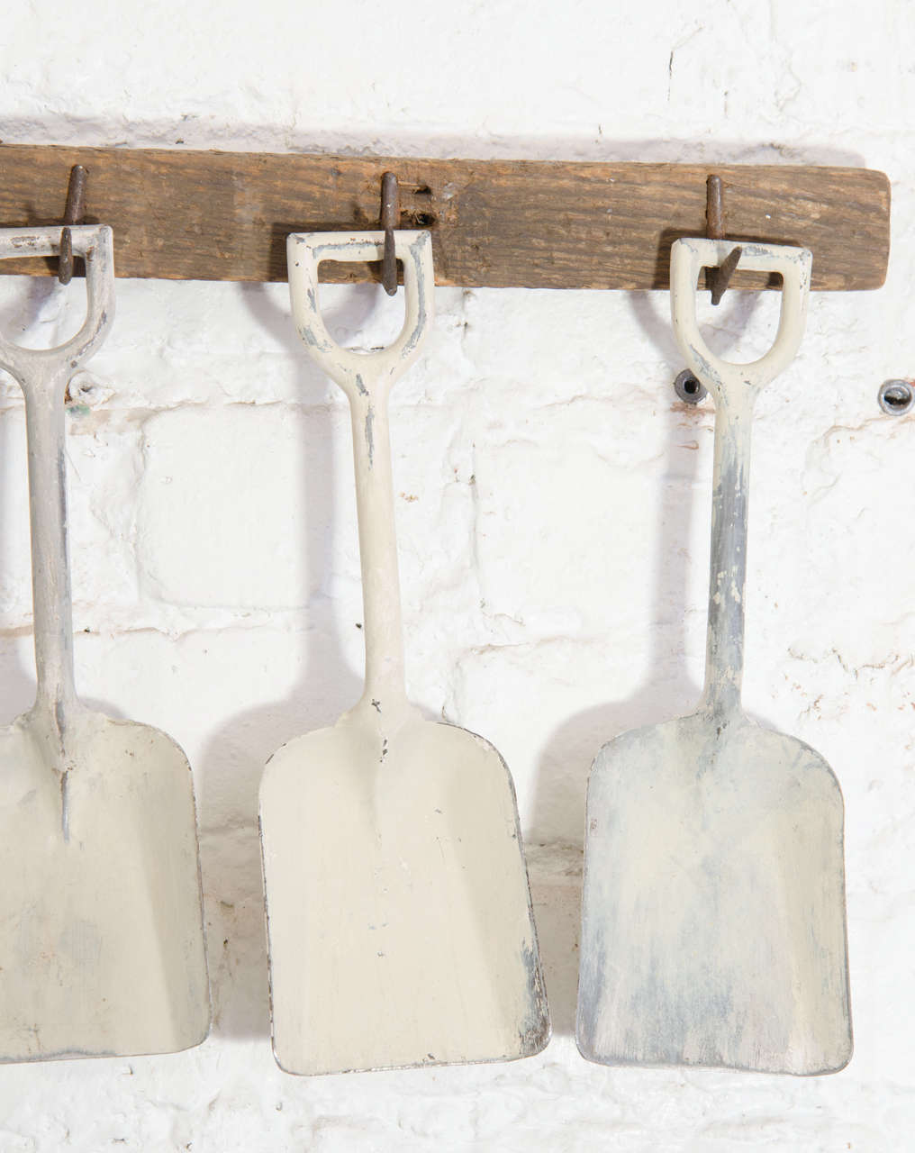Mid-20th Century White Sandshovels Suspended from Wooden Rack with Iron Hasps