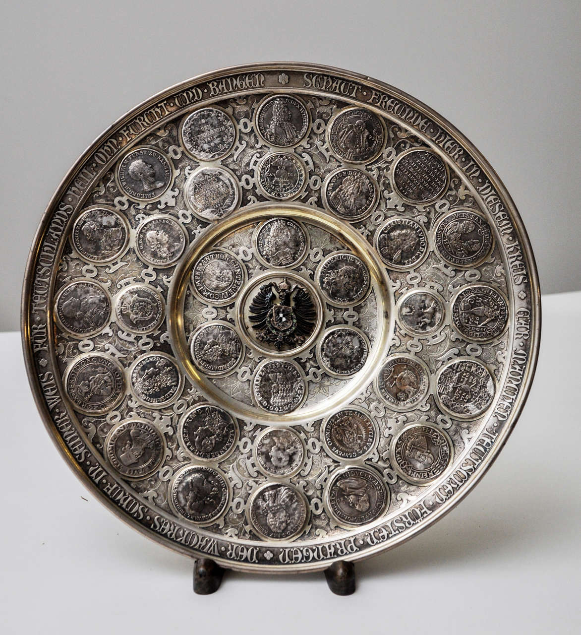 A German Silver Sy & Wagner Platter, Berlin, Circa 1890
Inset with various 16th through 19th century European coins, center has an enamelled crest.
Marked 