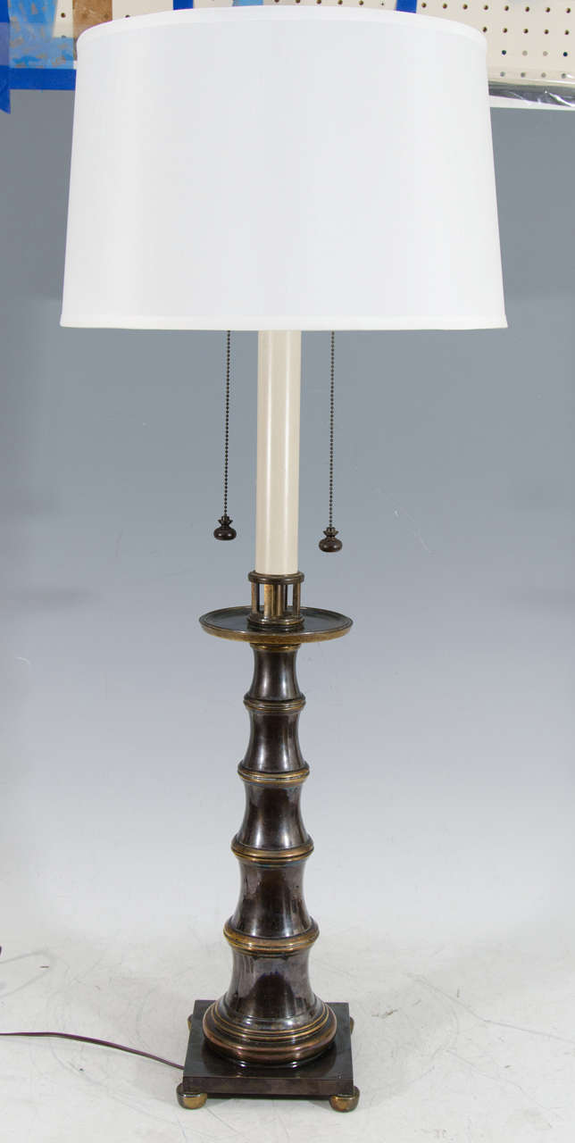 A vintage pair of brass and pewter colored faux bamboo table lamps with ball feet by Stiffel

Good vintage condition with some pitting, and wear to the enamel
