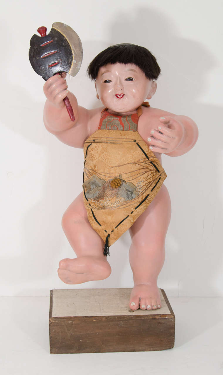 A Japanese Musha Ningyo of Kintaro in the style of Gosho and Iki Ningyo.  Very rare for its size, this is an early example of this Musha-Ningyo (Boys' Day Figure). This legendary figure first appeared for Boys Day in the late 19th Century.  He is