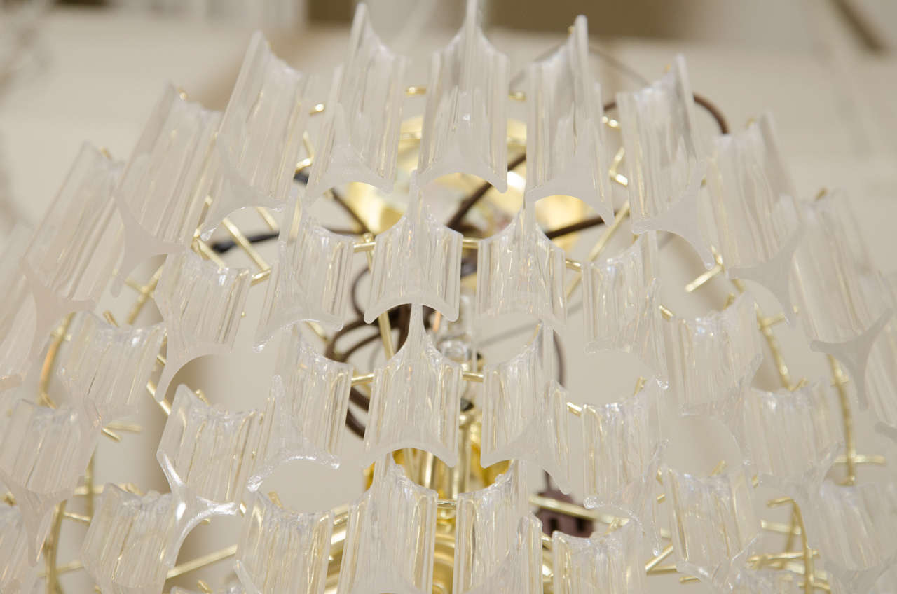A Midcentury Pair of Brass and Lucite Five-Tier Chandeliers 1