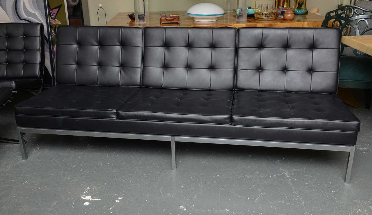 Sharp leather 3 seater sofa with solid aluminum legs.