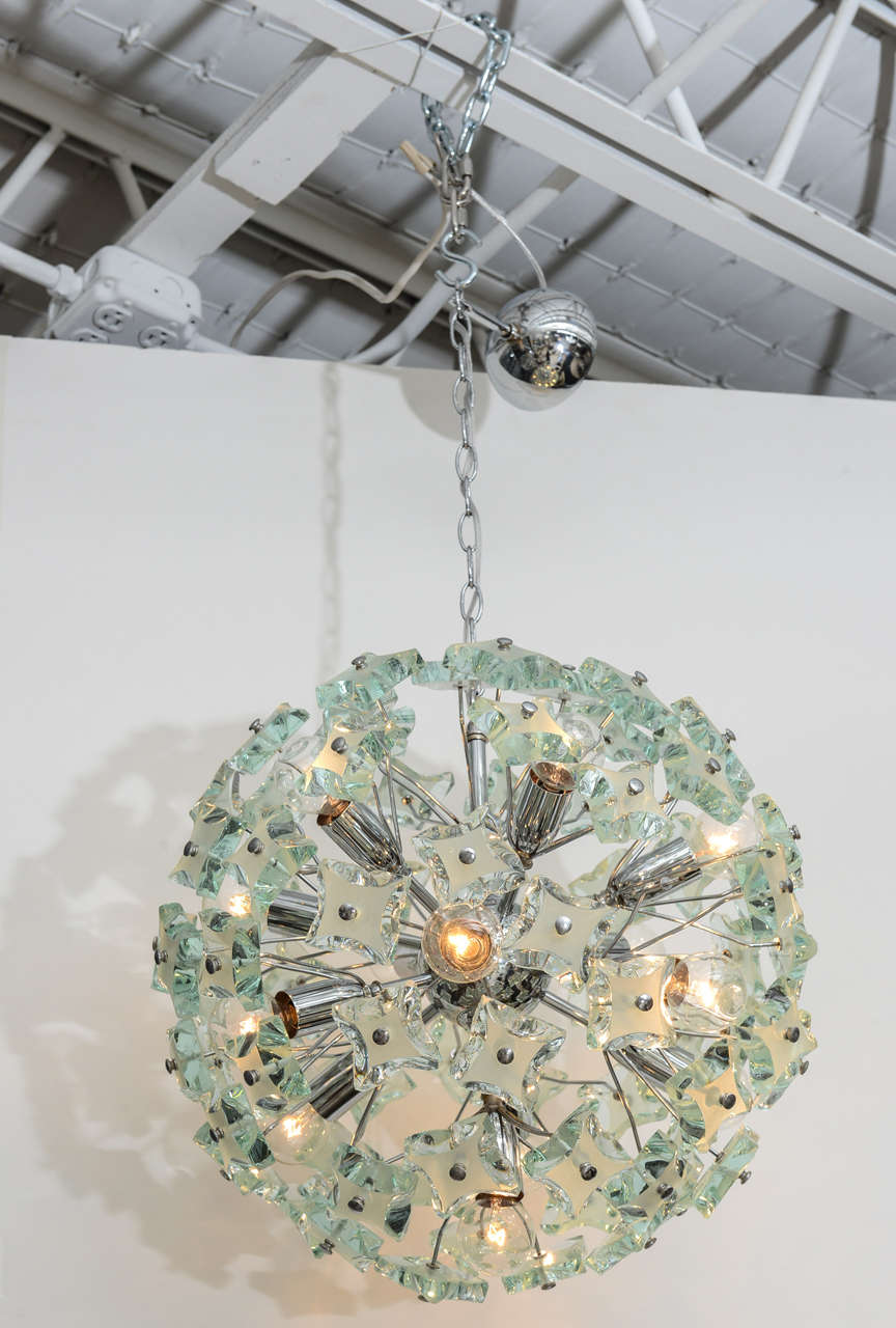 We're enchanted by this dandelion-style 60's Italian sputnik chandelier. The 13-light, chrome frame holds gorgeous green glass pieces, etched and hand-faceted in the manner of Max Ingrand.