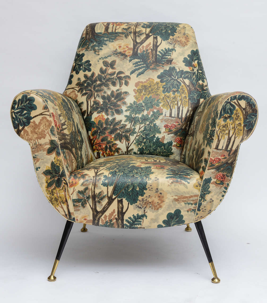 We couldn't bare to change the original upholstery on this 50's Italian lounge chair! Back and sides are forest green vinyl, while the seat and arms are a vinyl-coated cotton with a whimsical, woodland print. (We imagine it today in the chicest