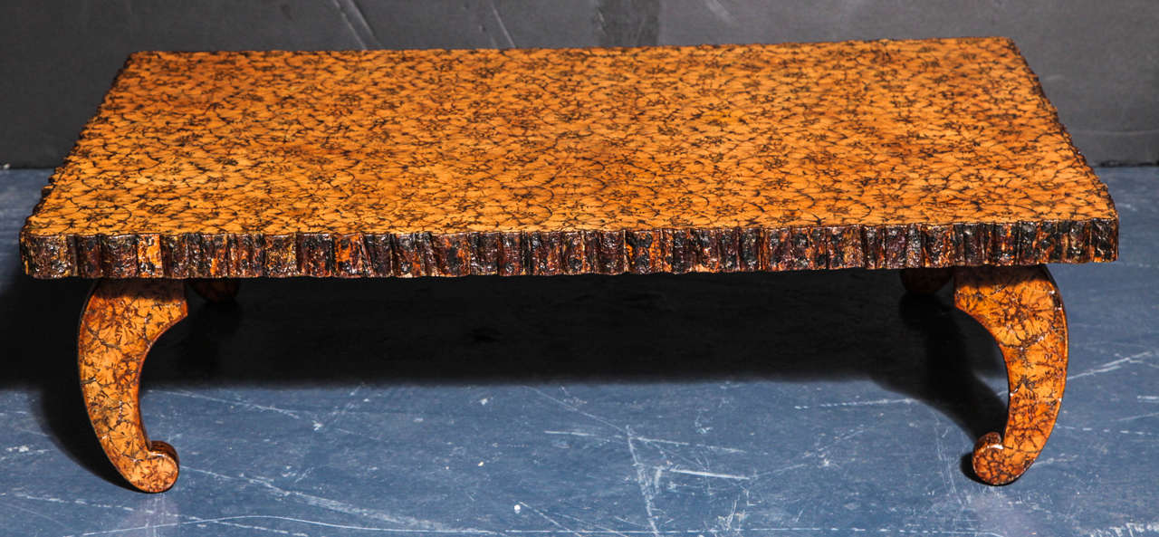 Whimsical oyster-veneered low table with bark-veneered edge; on scroll-form feet. Lovely amber coloration.