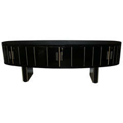 Huge buffet covered with black mirror . Huge buffet covered with black mirror .