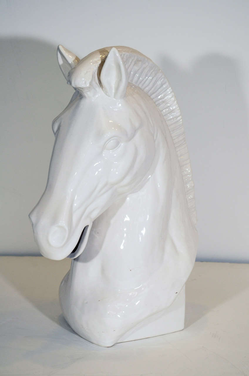 A vintage ceramic bust of a white horse head with glossy finish. It is in good vintage condition with age appropriate wear.