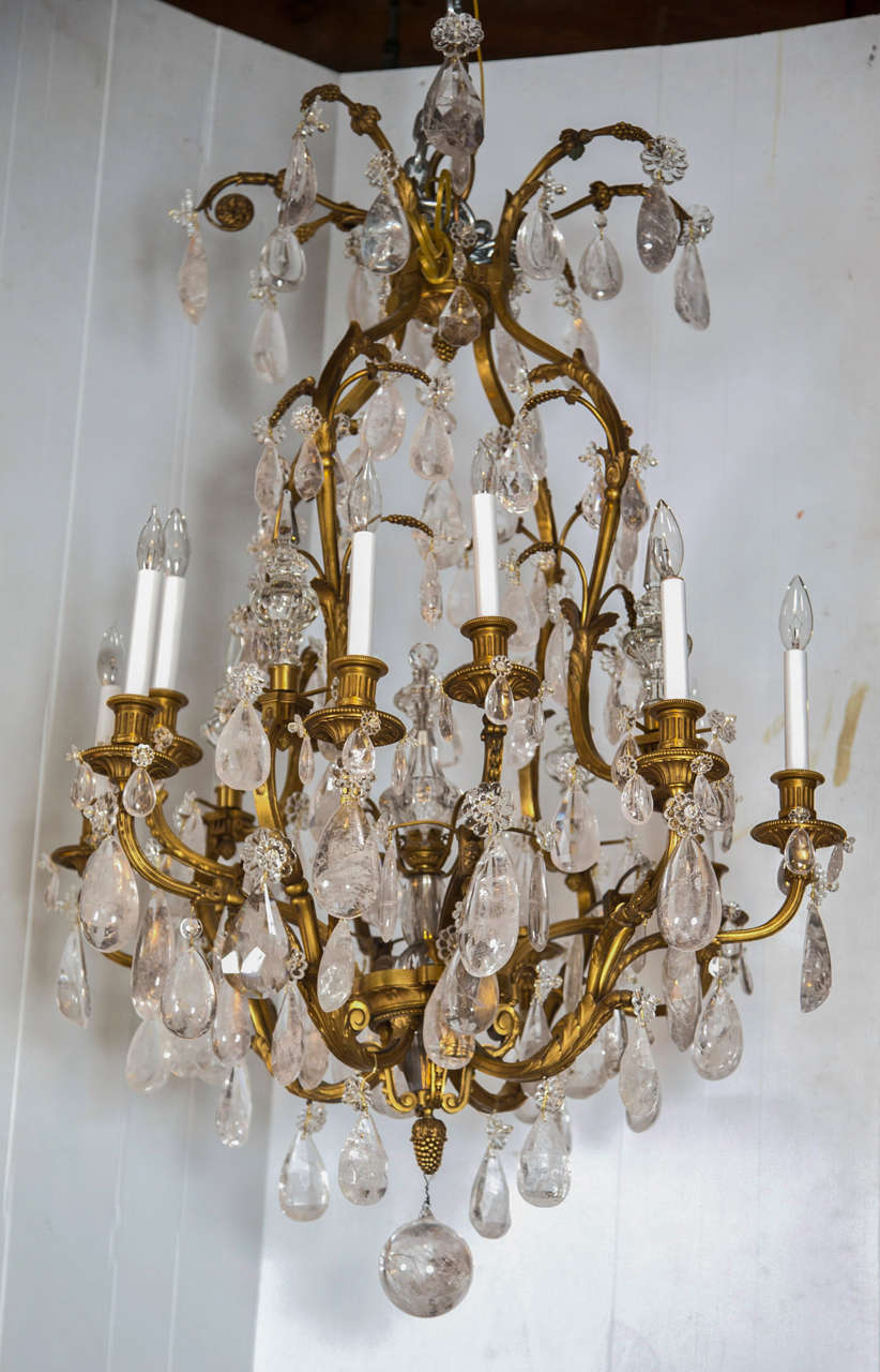 19th Century Rock Crystal and Bronze Chandelier. This finely cast Dore bronze chandelier is mounted with all around Rock Crystals. Terminating in a center Rock Crystal ball. This piece directly from a Madison Ave Apartment.