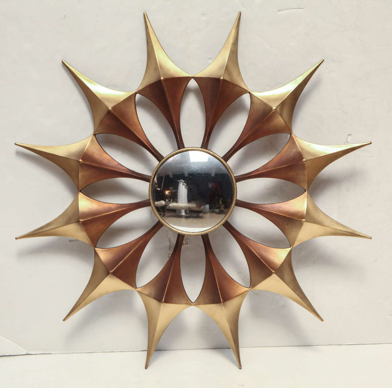 1970's convex gold starburst mirror.