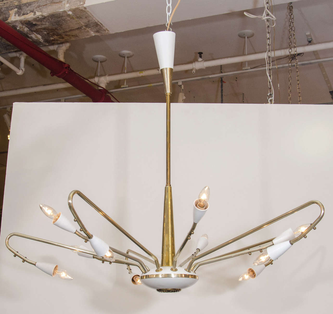 Beautiful and chic! A gracefully formed chandelier pendant with brass arms and armature; trimmed in white and with original canopy. Please contact for location.
