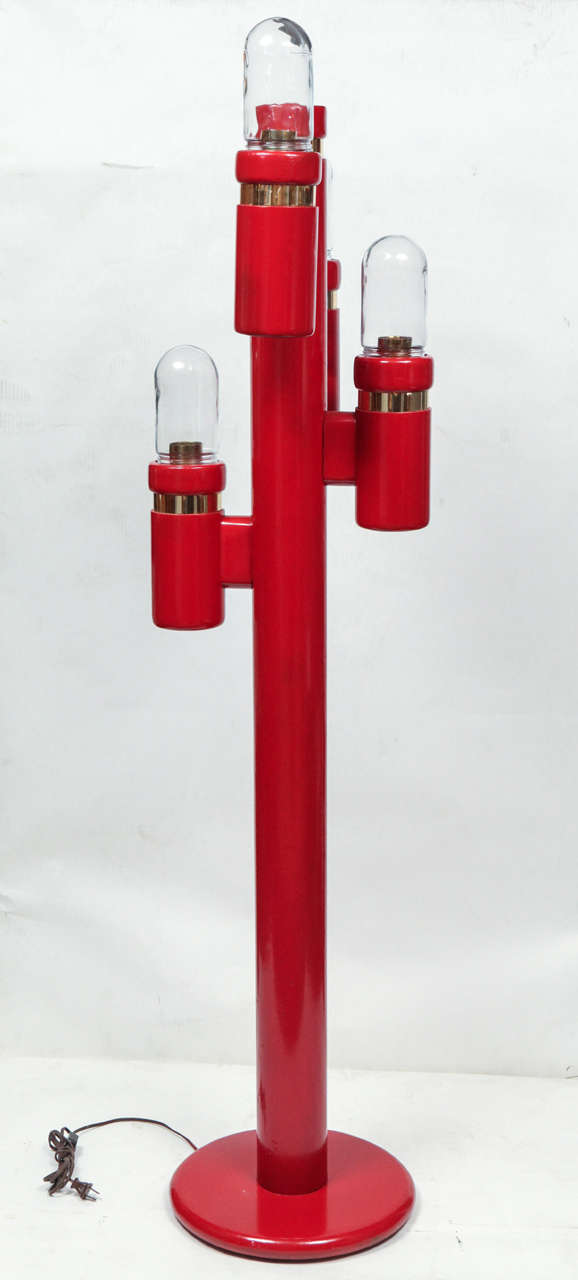 A red vintage 1960s cactus floor lamp with four lights. Lacquered wood with brass trim and glass globes.