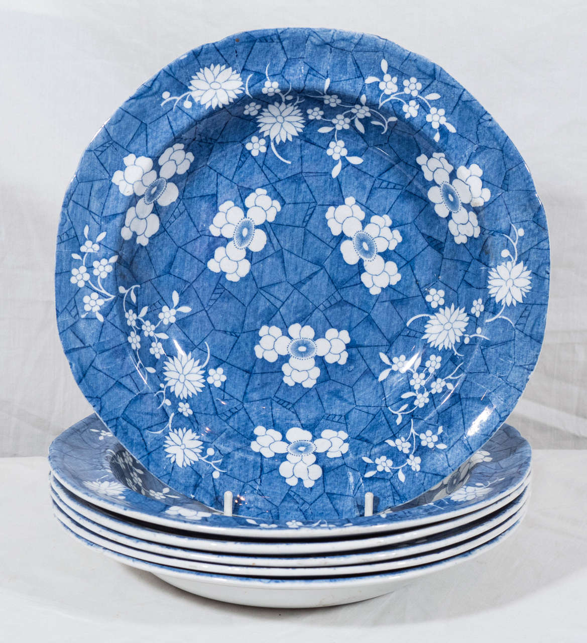 A set of a six Spode Blue and White soup dishes made in the first quarter of the 19th century and decorated in an overall pattern of hawthorne blossoms on a 