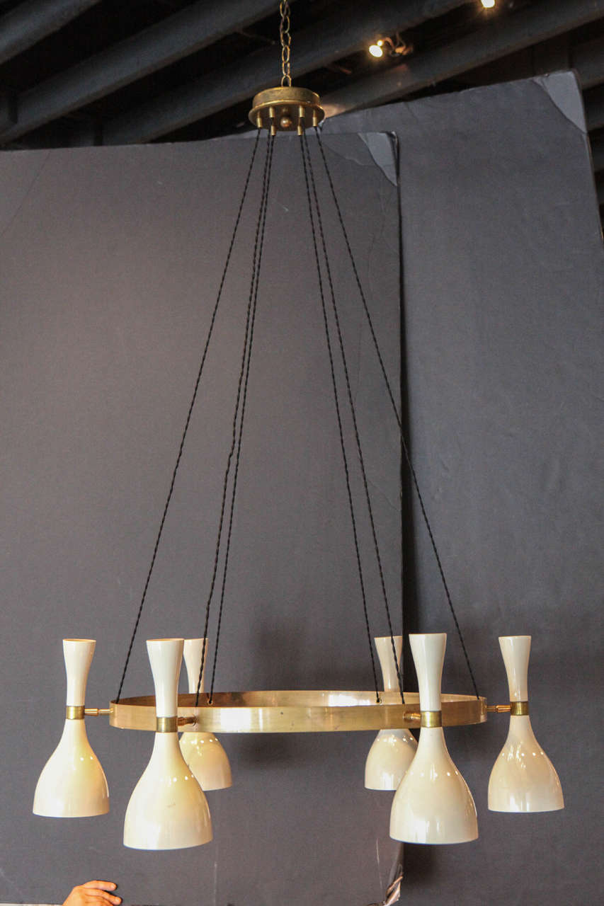 A pair of six-pendant chandeliers from italy.
Can be sold individually. Both chandeliers have the original canopy.