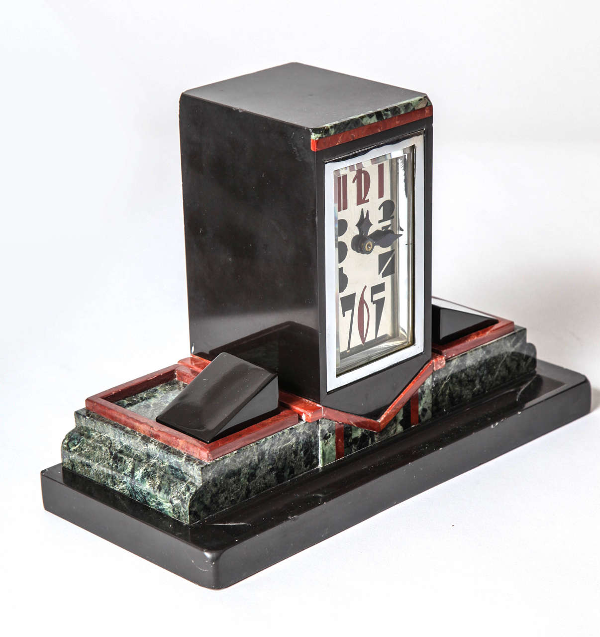 An Art Deco French Marble Nickel Plated Bronze  and Brass Desk Clock with a Stylized Enamel Dial and Double Inkwell. Keywind Movement in working order.
