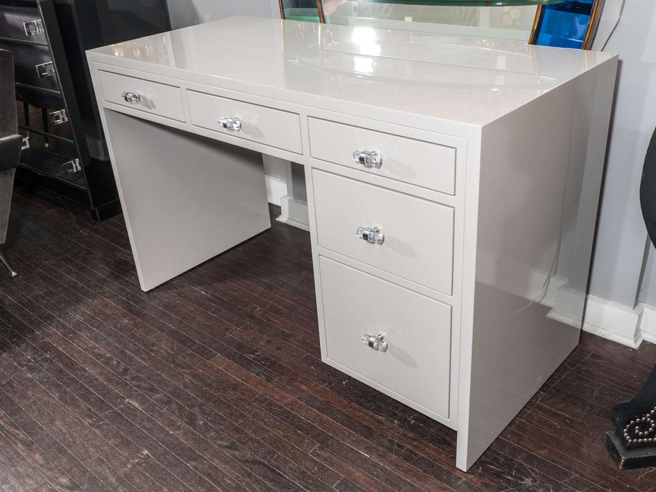 Custom 5-drawer lacquered desk with polished chrome & lucite knobs. The color of the desk shown in the photos is Benjamin Moore - Cumulus Cloud 1550. Customization is available in different sizes, colors, finishes and hardware/COM.