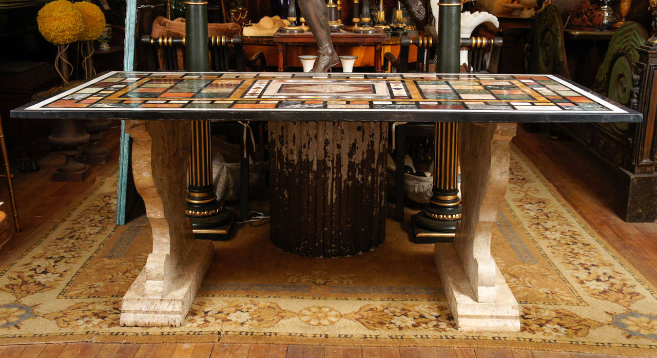 This very fine table made in Rome in the very late 19th or early 20th century is of dramatic design and using costly material. The base carved from solid travertine is in a Renaissance style. The stone was used throughout ancient Roman times to