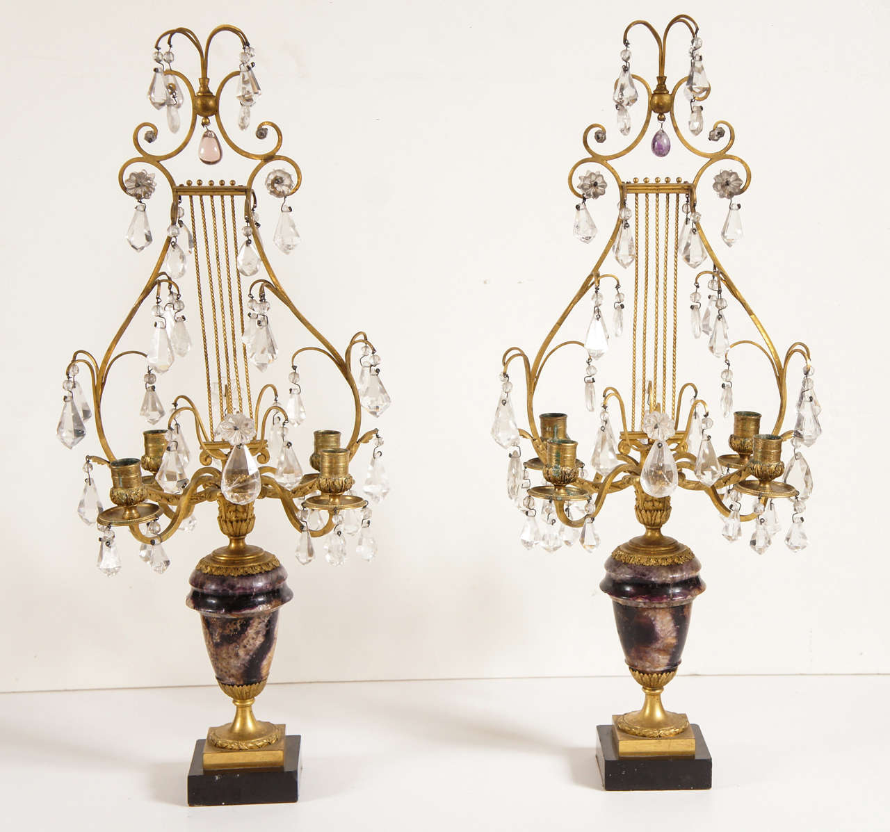 This fine pair of four-light candelabra are English and made circa 1820. In the manner and style of the great English sliver and bronze craftsman Matthew Boulton, they are made from the finest materials to and to exacting standards. The  Urn shaped