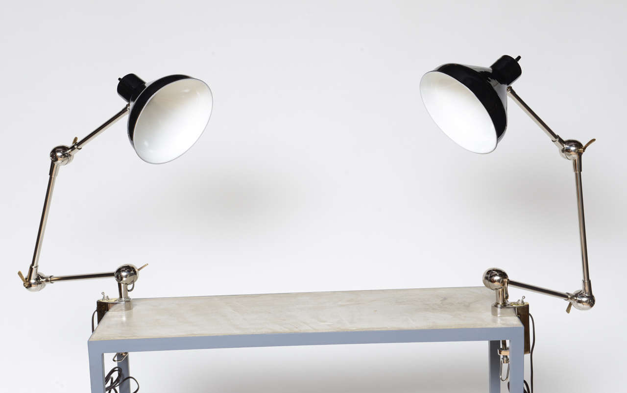 ONLY ONE AVAILABLE - Beautifully restored, this articulating clamp lamp with three moving sections with black aluminum shade make for a very designer look.