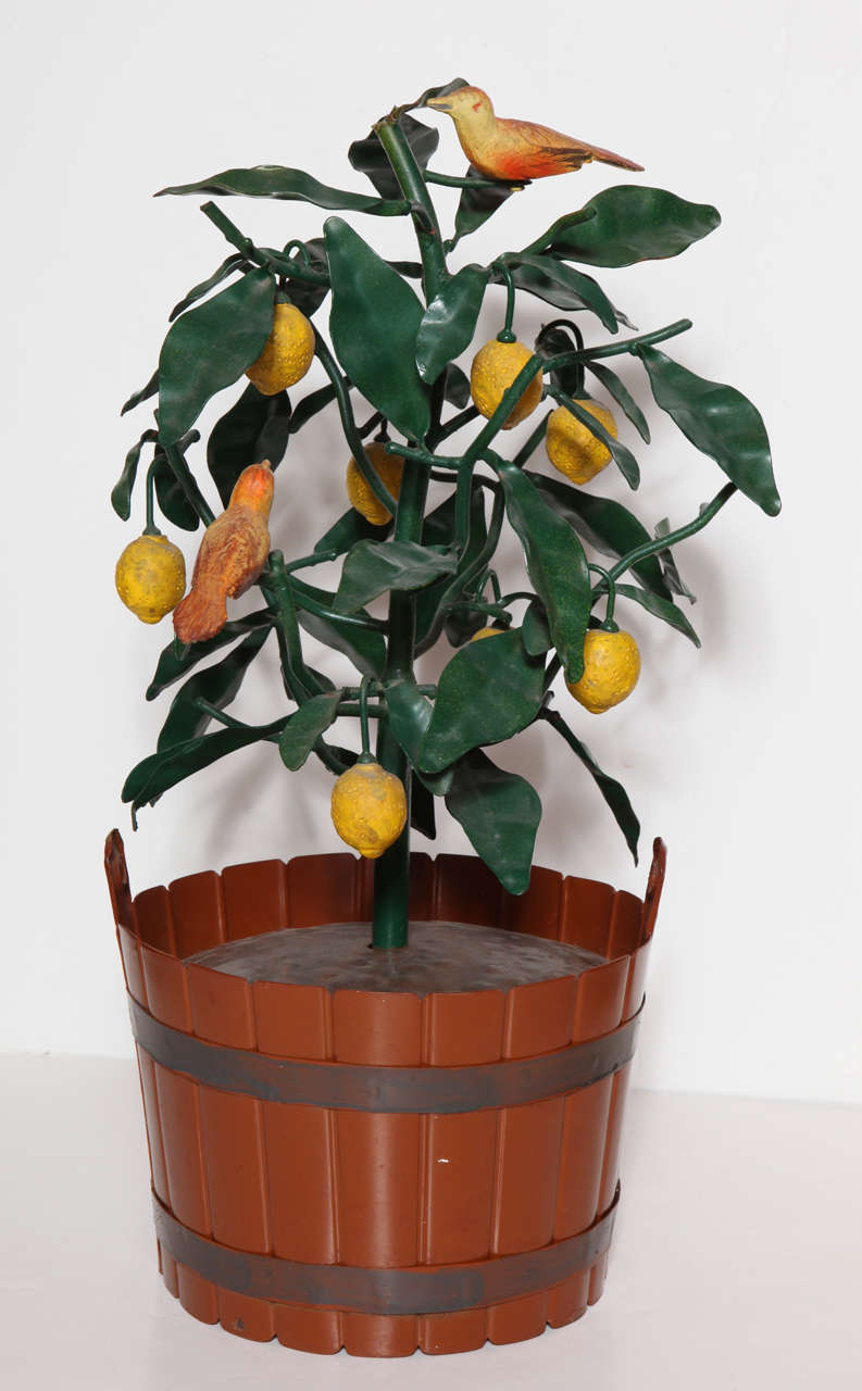 A delightful Italian tole potted lemon tree with petite songbirds nestled in its branches. 