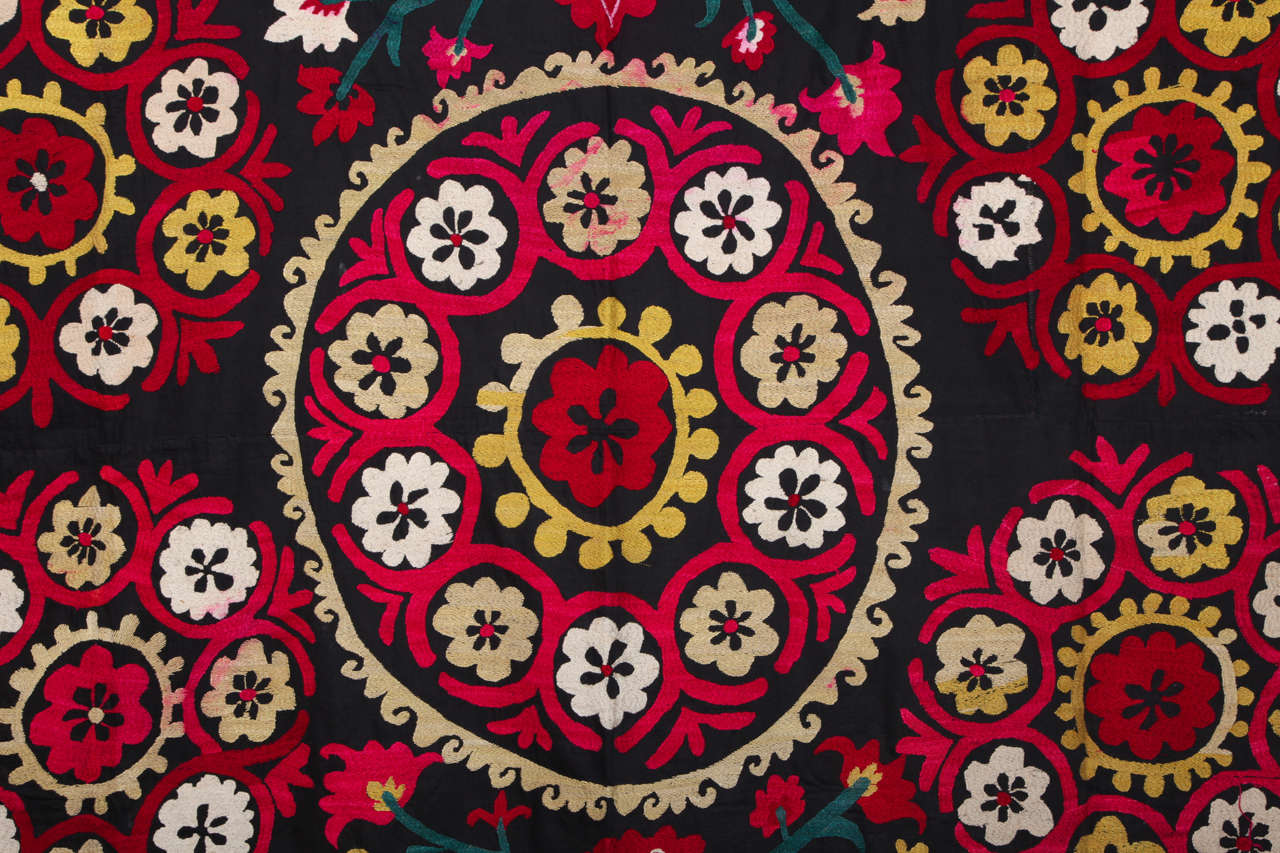 A vintage black cotton ground Turkish suzani embroidered with cotton thread. Handmade. Mid-20th century.