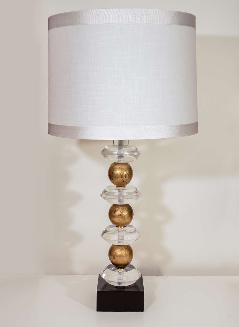 Pair of Art Deco Lucite disc and Gold Leaf sphere lamps signed Van Teal. Shades not included.