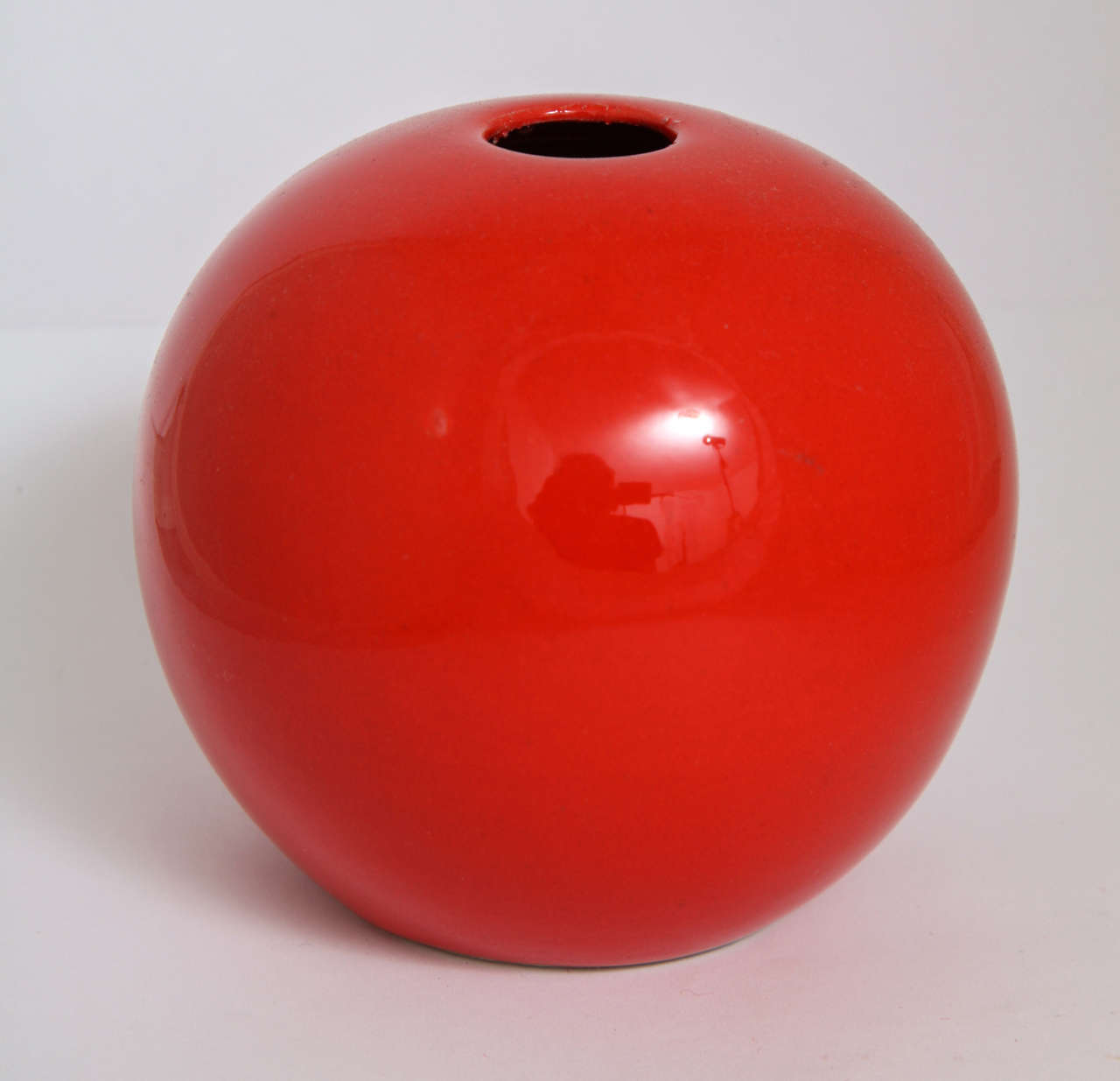 Italian modernist vase in candy apple red glaze.  Imported by Raymor and marked with sticker to base.