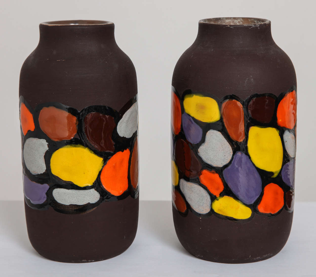 Store closing-- last day is 7/31. Offers welcome! Fantastic ceramic vases featuring matte brown bodies with pops of vibrant color. Bitossi design #1613 as signed to base. One retains the original Raymor sticker.