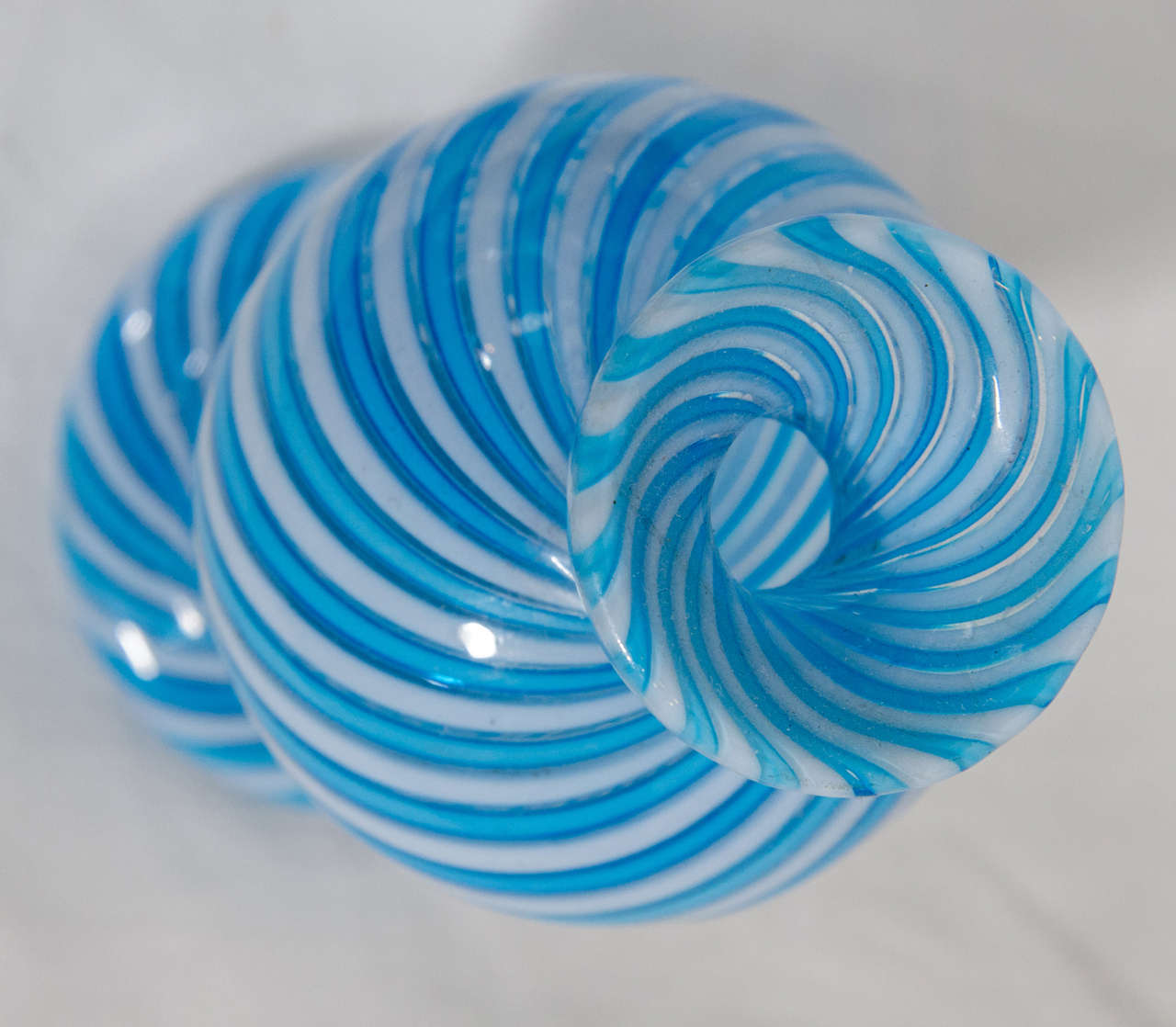 A delicate 19th century colored glass scent bottle and stopper with blue and white swirls.