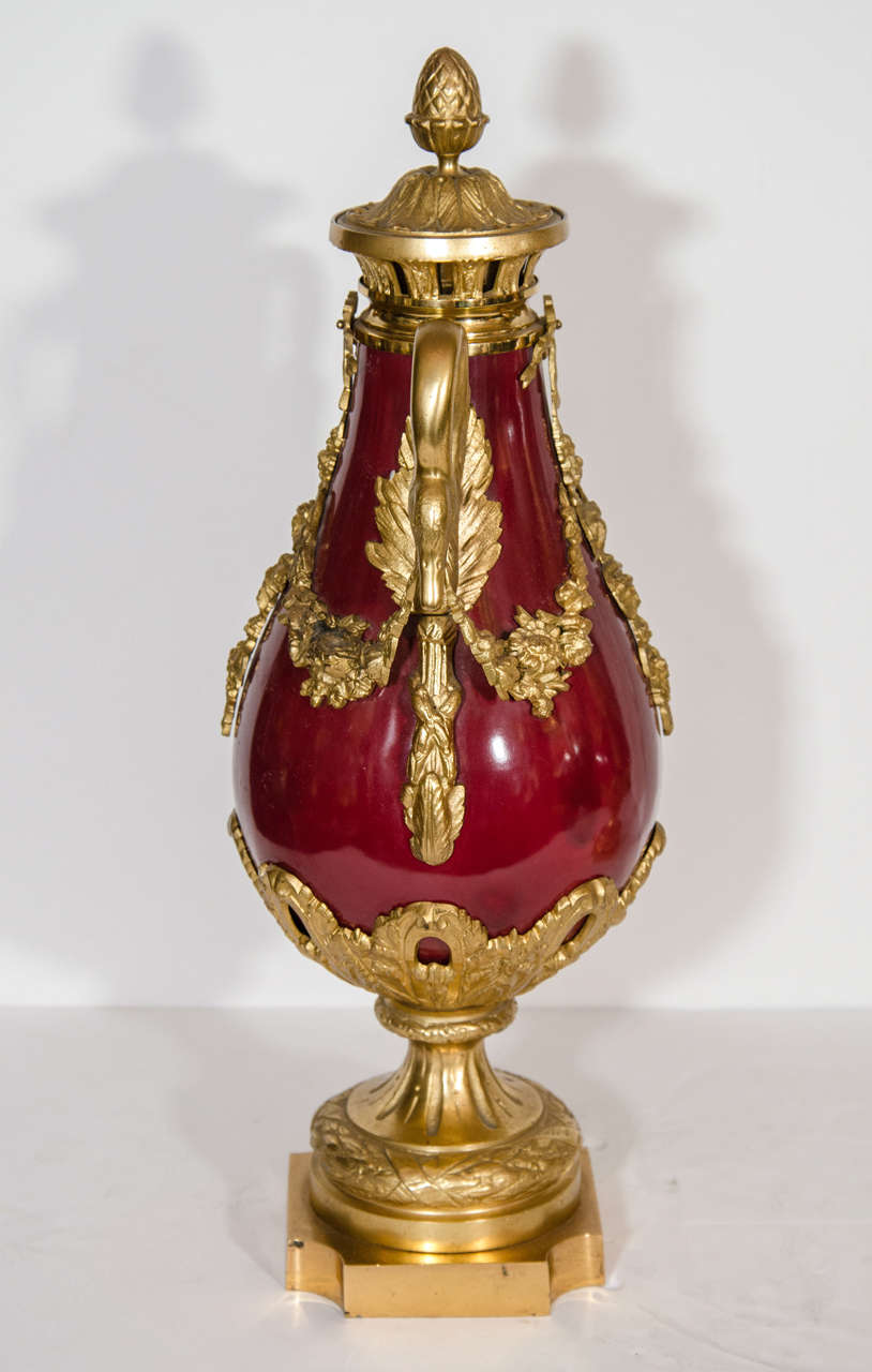 Pair of Antique French Louis XVI Gilt Bronze and Red Sevres Style Porcelain Urns In Good Condition In New York, NY