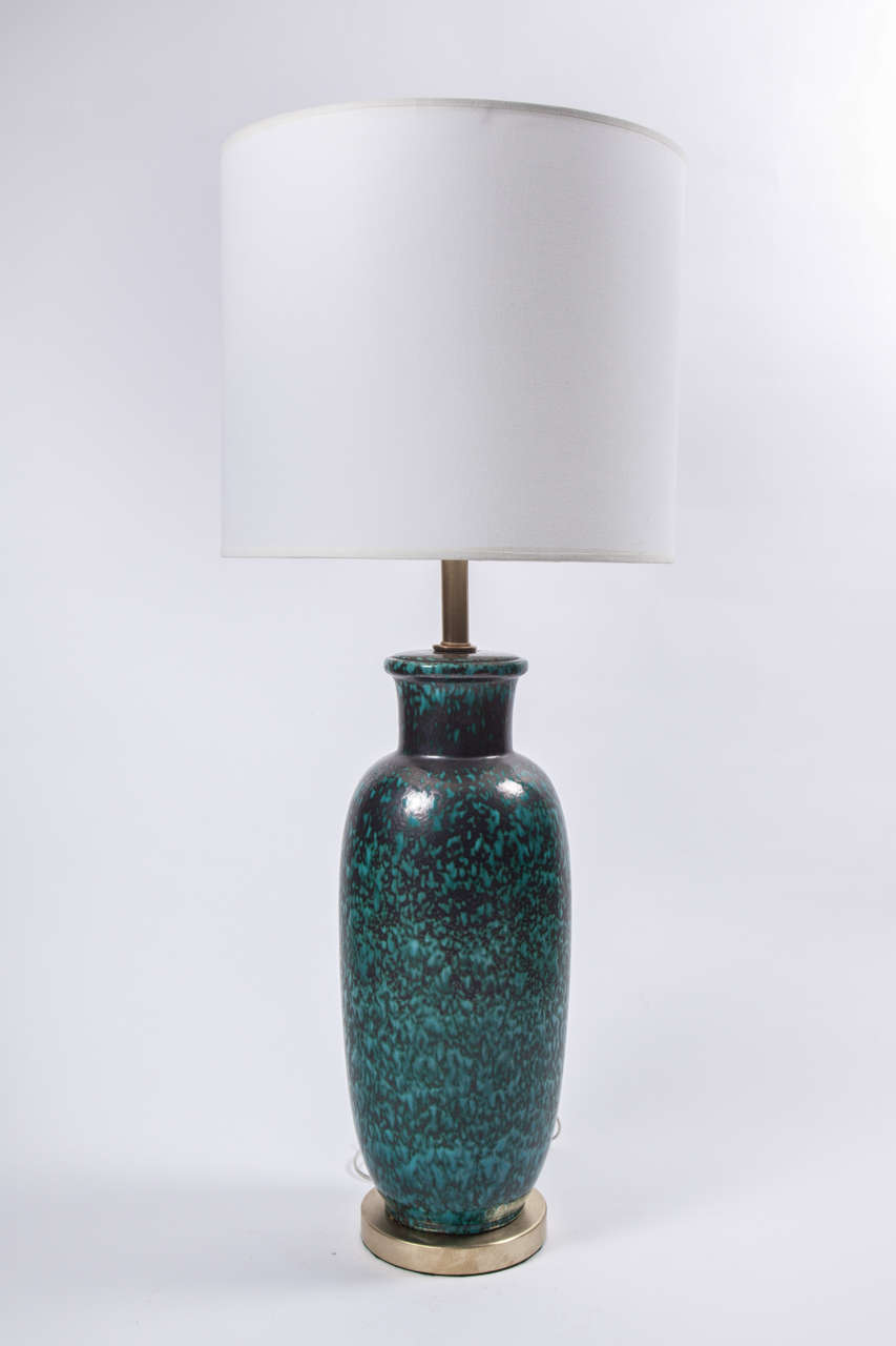 Fantastic pair of Italian jade green and black mottled matte glazed ceramic lamps. Lamps sit on satin brass bases and have been rewired with gold silk cord.