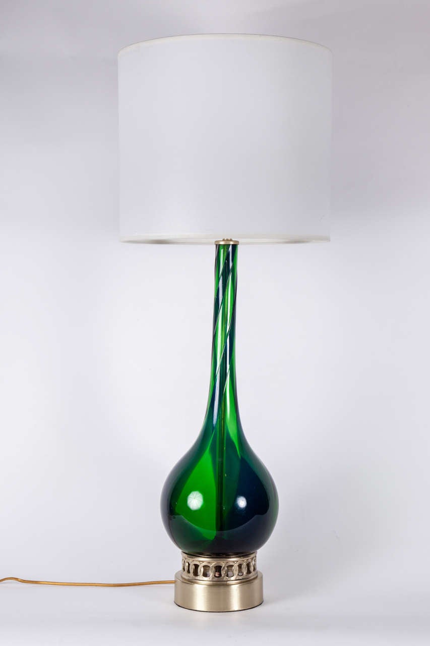 Striking  pair of Emerald Green Murano glass lamps with a dark blue glass spiral on satin brass bases. Rewired for use in the USA with brass hardware. Shades not included.