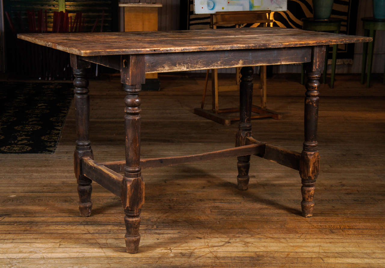 country table - off center stretcher base - two board top - all exhibiting great wear and patina - found in Michigan