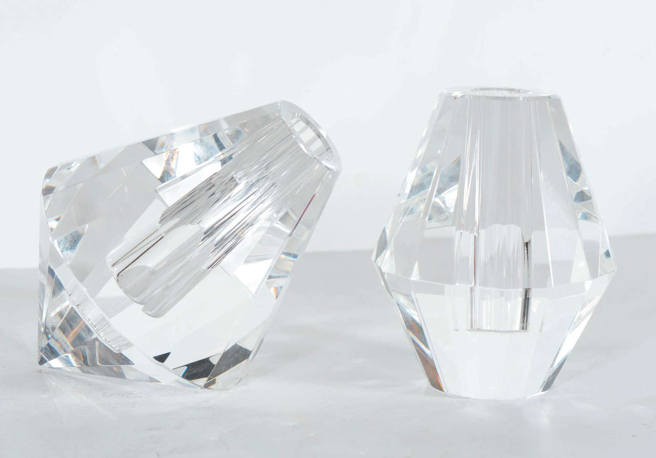 This stunning set of crystal bud vases by Shannon feature a diamond-like design, multi-faceted to catch the light and sparkle - each vase has a small vessel for holding water for a flower bud, one vase tilts at a 45 degree angle which contrasts from