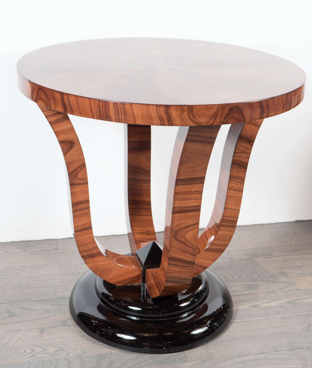 Pair of exquisite Art Deco Gueridon occasional tables in bookmatched walnut, burled Carpathian elm and black lacquer bases. These stunning tables feature tops that showcase exotic flamed walnut and bookmatched burled Carpathian elm that once