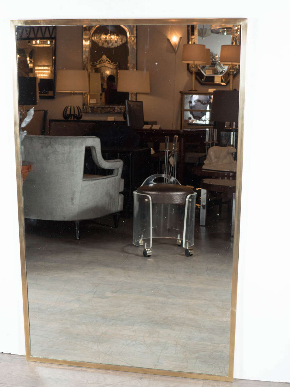 This Ultra Chic Mid-Century Modernist Mirror by La Barge features a slimline brushed brass trim and can be hung both horizontally and vertically. The mirror is in excellent condition.