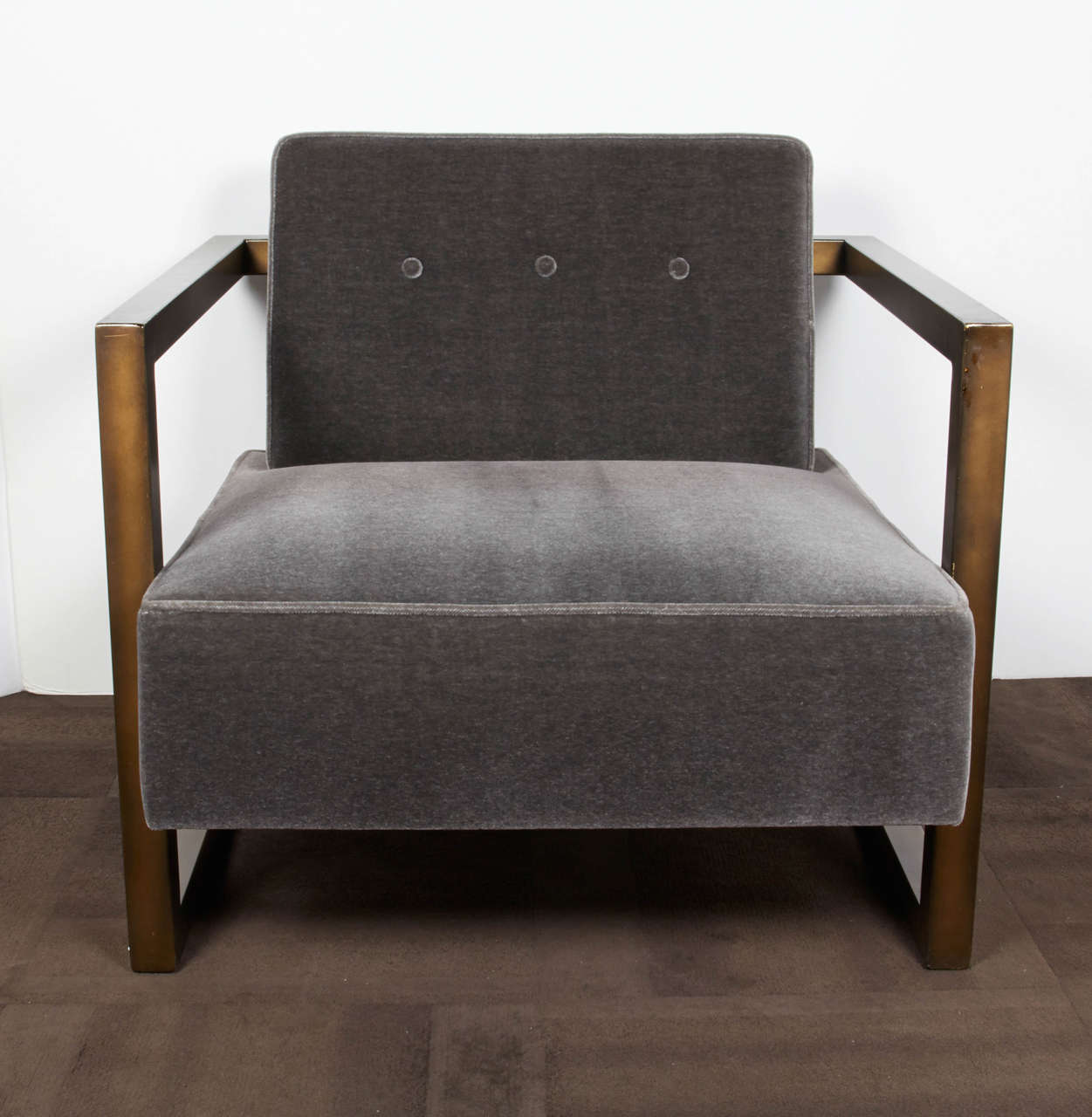 Outstanding modernist club chair with sculptural cantilevered metal frame. 
Newly upholstered in luxurious gunmetal mohair with button back details. The frame has a bronze coated finish, and is gorgeous from all angles.