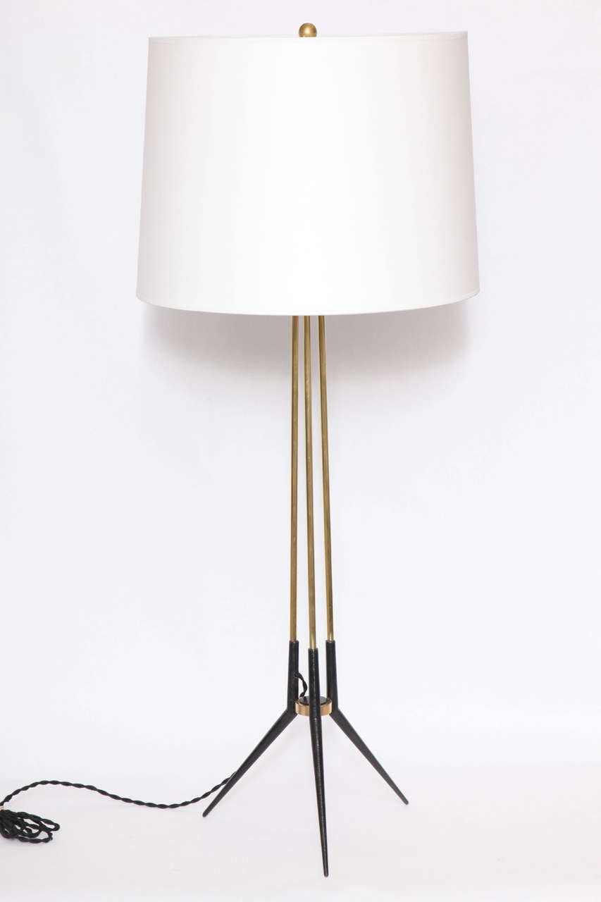 A 1950s French modernist painted metal and brass table lamp.
Shade not included