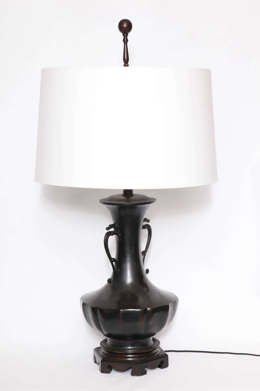 A 1920s classical modern Japanese patinated bronze table lamp.