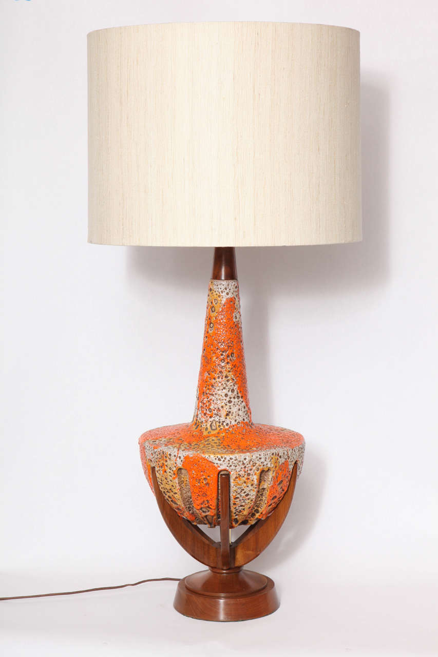 A 1950s modernist ceramic and wood table lamp.
Shade not included