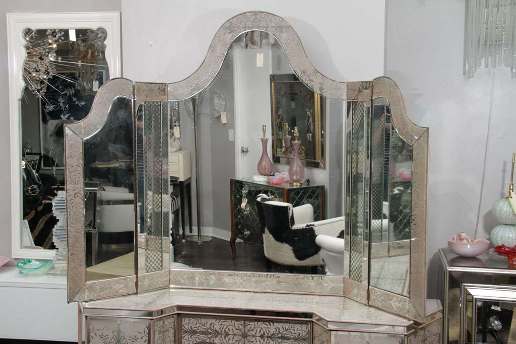 1940's Egliomise Mirrored Vanity with a tryptic mirror, one drawer and two revolving sides