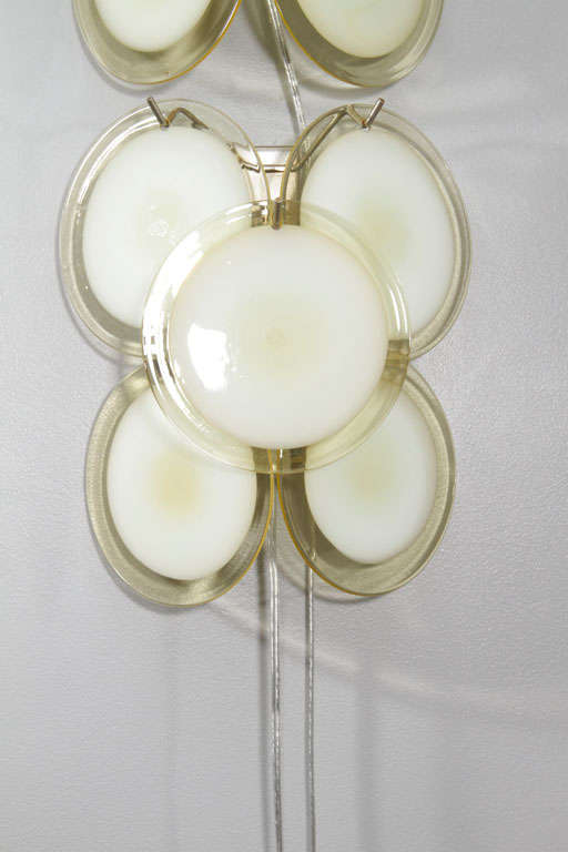 Pair of vintage yellow Murano glass disc sconces in the style of Vistosi.