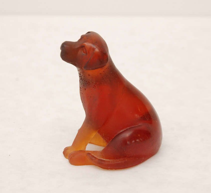 This charming amber dog is a beautiful example of Daum's pâte-de-cristal casting technique.
